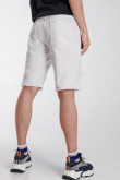Bermuda Slim de jean blanca, tiro bajo con rotos