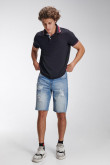 Camiseta Polo unicolor, puños y cuello tejidos.