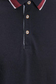 Camiseta Polo unicolor, puños y cuello tejidos.