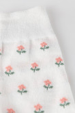 Medias largas color crema con diseño de flores