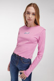 Camiseta unicolor, manga larga con cuello redondo.