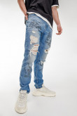 Jean Skinny azul medio con rotos y estampado