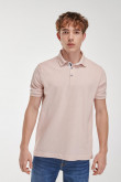 Camiseta polo manga corta rosada y cuello tejido