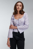Blusa con cordón para anudar en frentes y corte peplum.