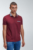 Camiseta Polo unicolor con cuello tejido.