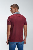 Camiseta Polo unicolor con cuello tejido.
