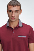 Camiseta Polo unicolor con cuello tejido.