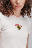 Camiseta crop top, con costuras en contraste con estampado en frente