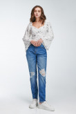 Blusa En tela fluida con escote en frente y espalda encauchada.