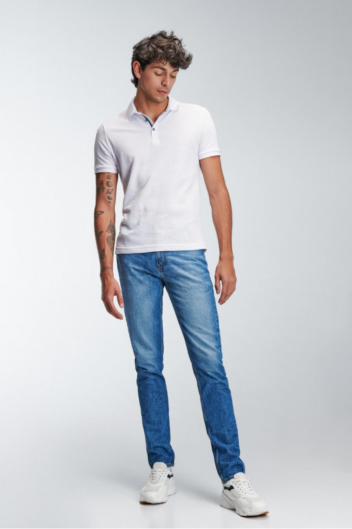 Camiseta Polo unicolor con cuello tejido.