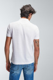 Camiseta Polo unicolor con cuello tejido.