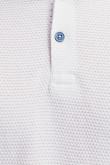 Camiseta Polo unicolor con cuello tejido.
