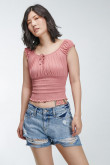 Blusa manga sisa con encauchado en corte inferior y espalda.