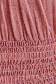 Blusa manga sisa con encauchado en corte inferior y espalda.