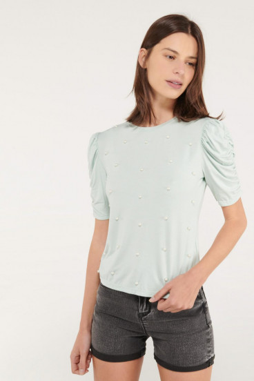 Camiseta manga corta unicolor con perlas.