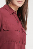 Blusa unicolor, doble bolsillo