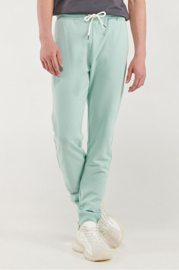 Pantalón jogger crema con pretina y puños en rib