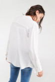 Blusa unicolor, con bolsillo